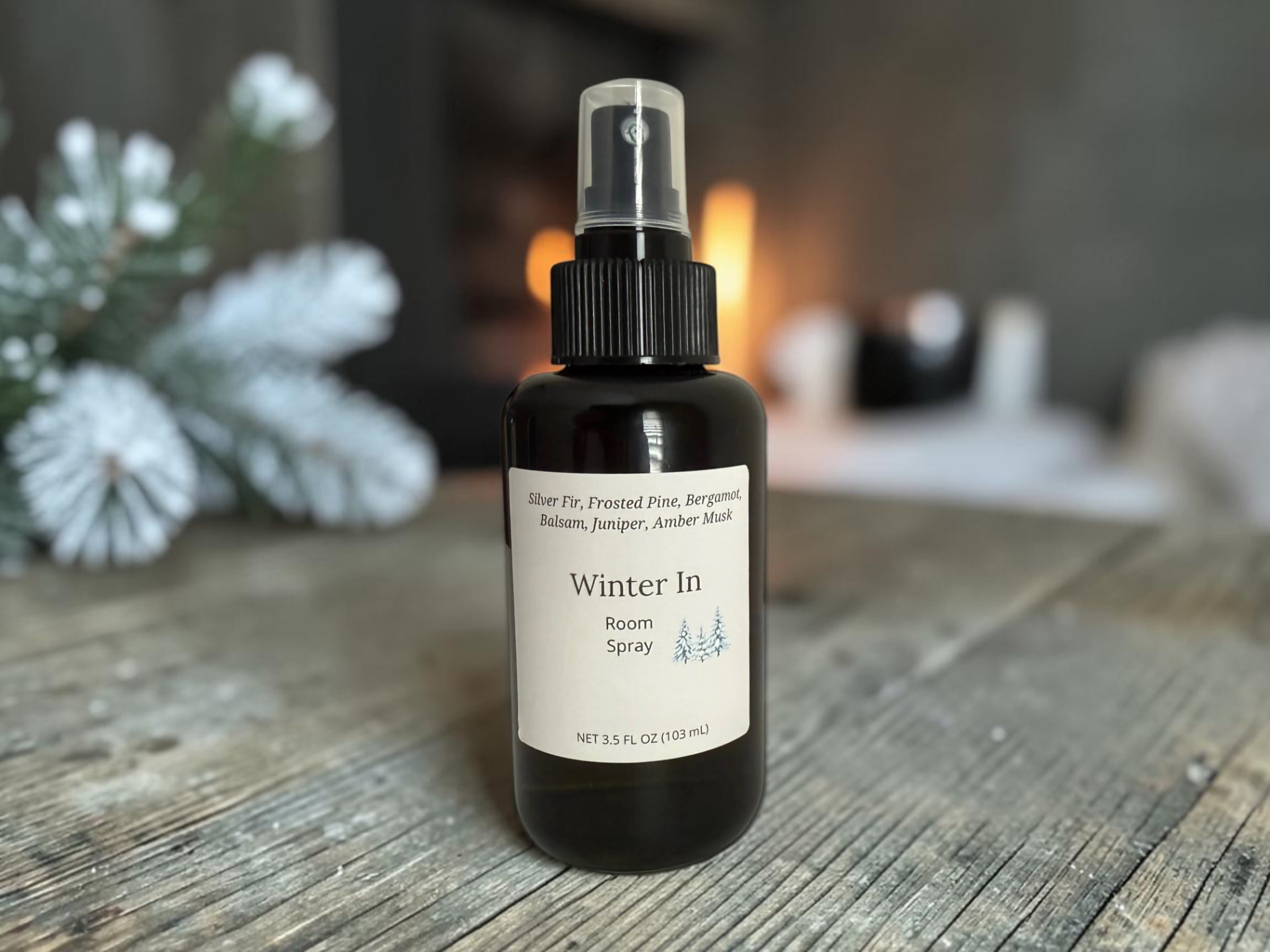 Winter In Room Spray, a clear glass bottle with frosted pine and balsam greenery