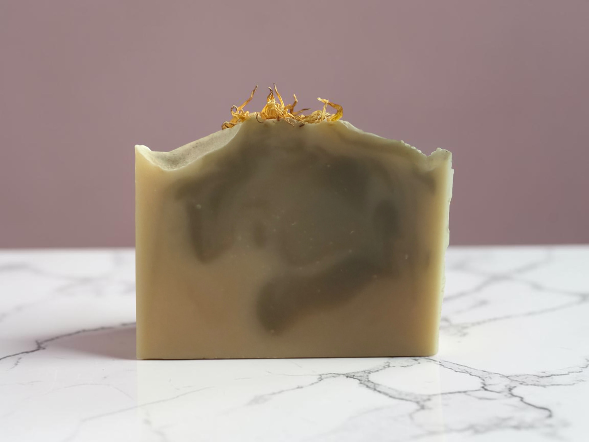 Alpine Suede Soap, a woodsy handmade bar on a marble counter