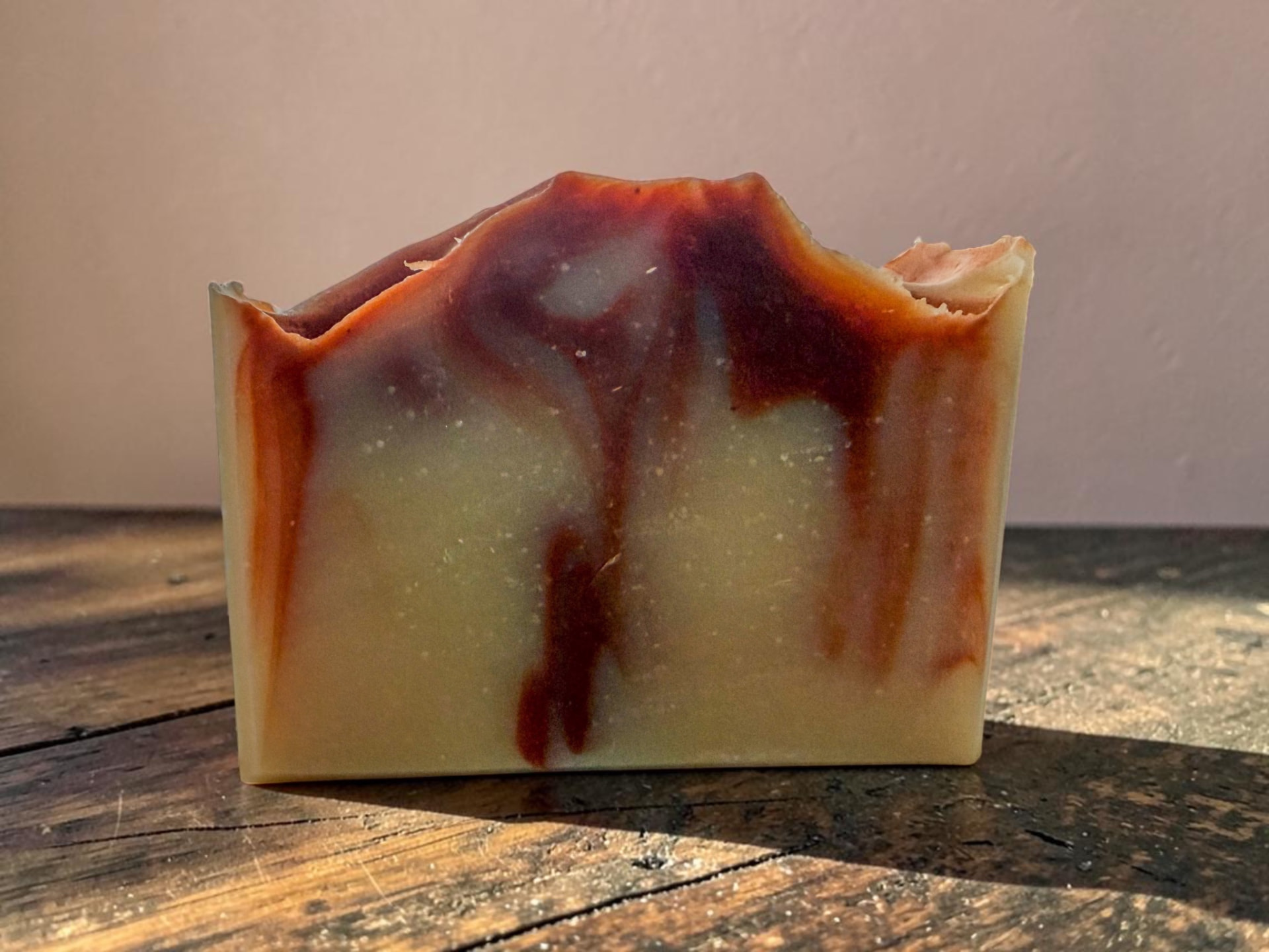 Evening Bloom Soap, a soft floral handmade bar with jasmine petals and warm amber light